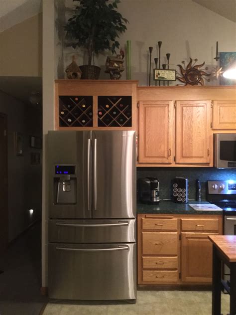 above fridge decor|10 above refrigerator cabinet ideas.